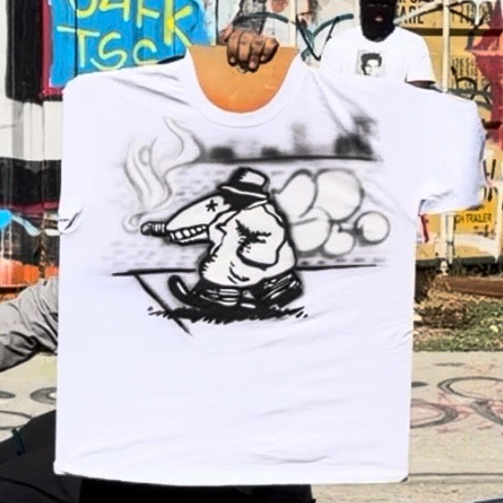 White short-sleeve tee featuring black cartoon artwork of a smoking character in a hat.
