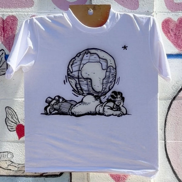 White short-sleeve tee featuring black cartoon artwork of a reclining woman balancing a globe on her back.